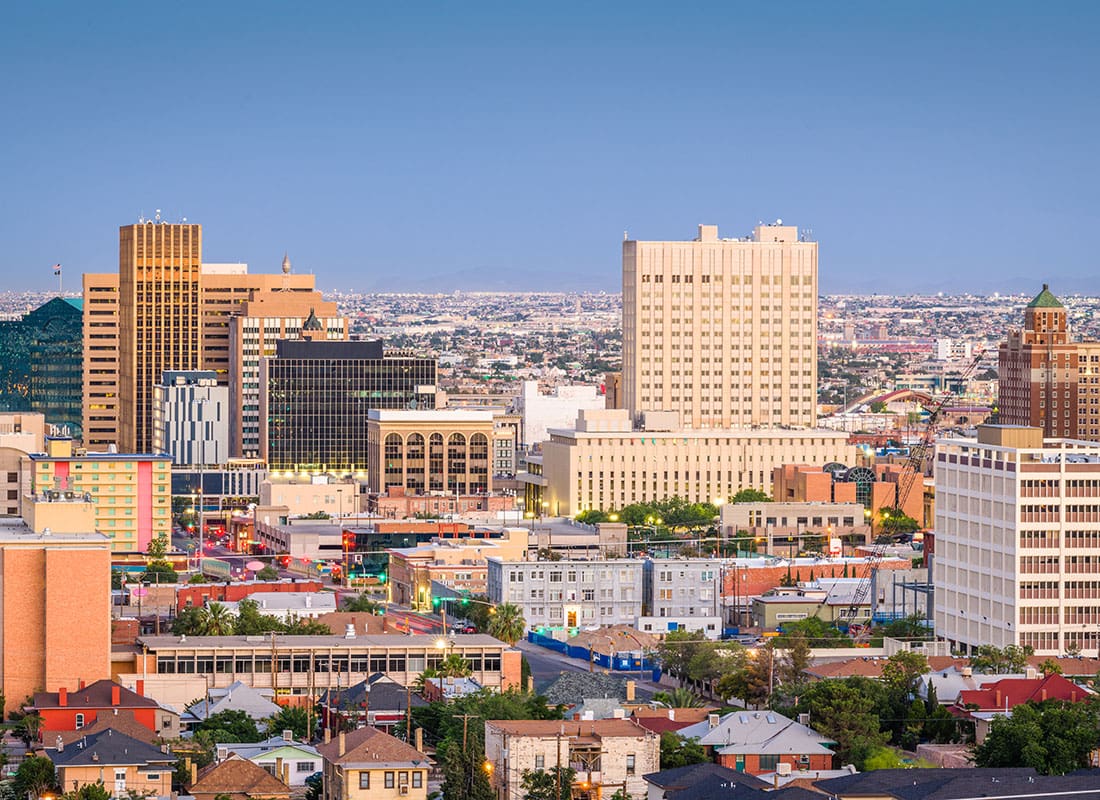 El Paso, TX - Aerial View of Buildings and Homes in Downtown El Paso Texas Against a Blue Sky
